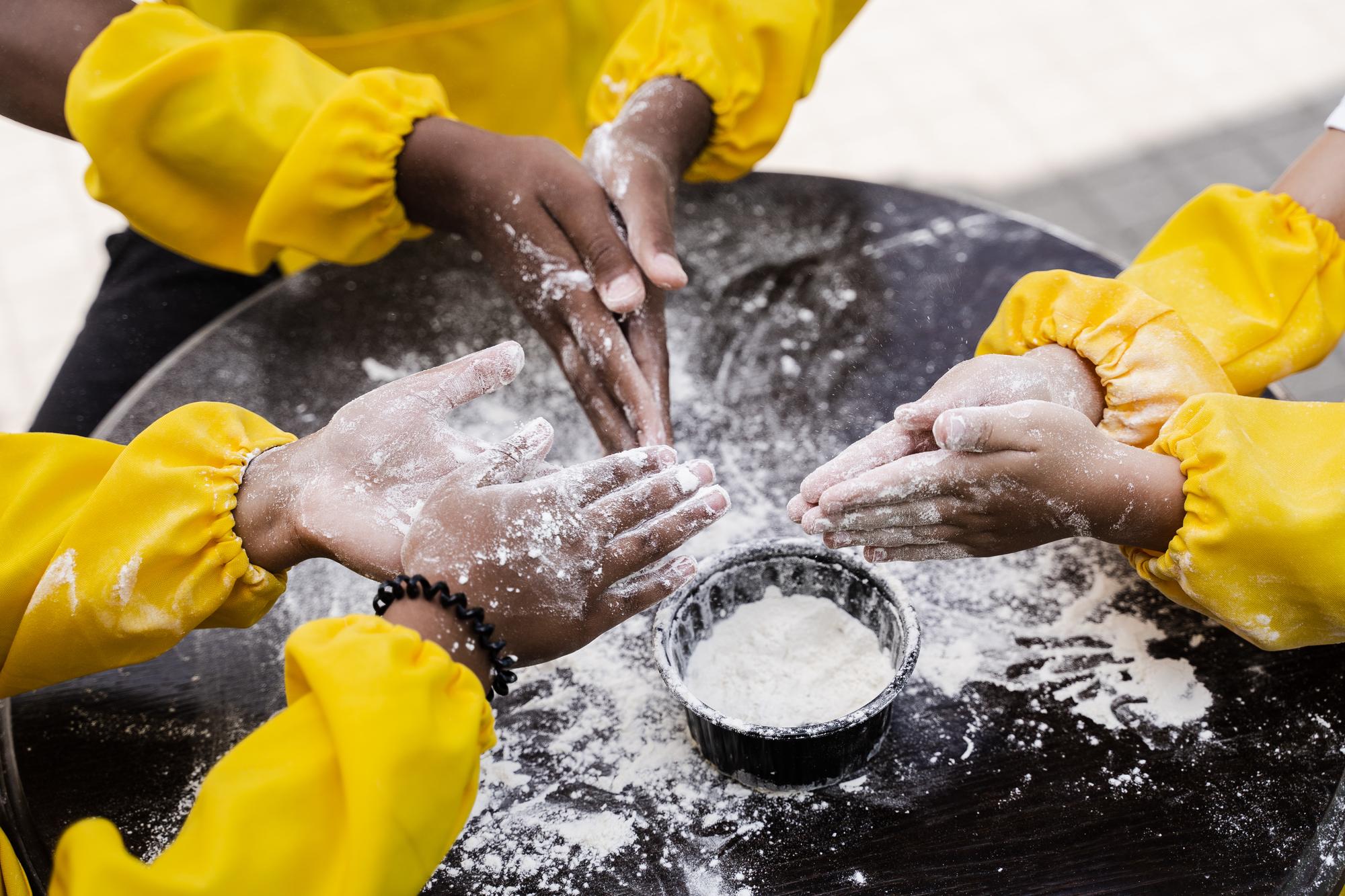 Instructor demonstrating dough technique to participants