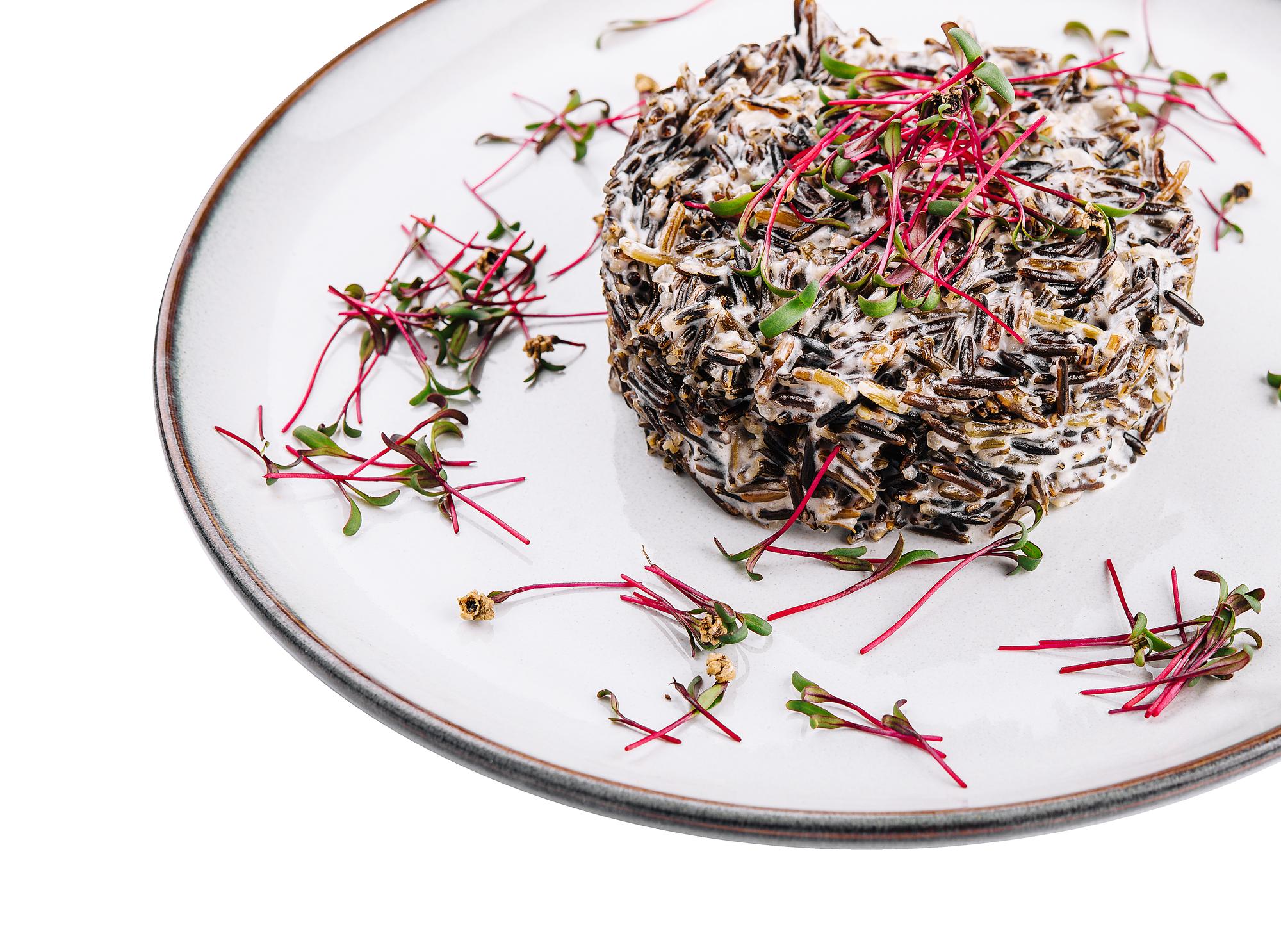 Close-up of plated dessert with micro herbs
